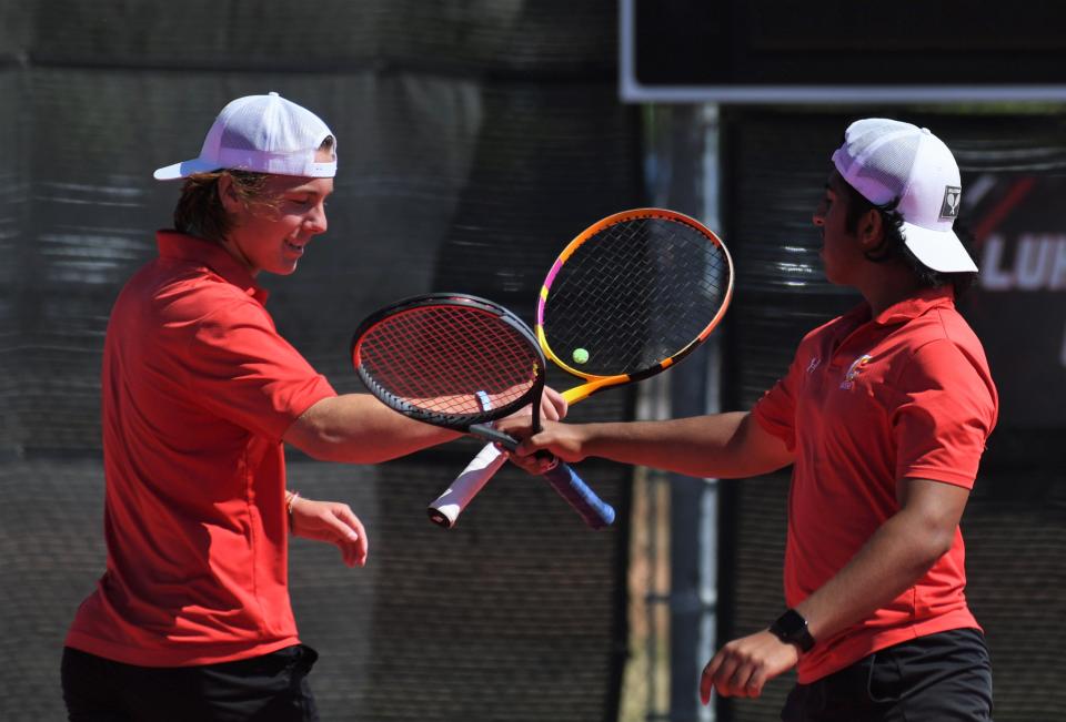 Coronado's Thomas Mann, left, and Daniel Warraich celebrate a point in a boys doubles first-round match at the Region I-5A tennis tournament Monday, April 10, 2023, at Texas Tech's McLeod Tennis Center.