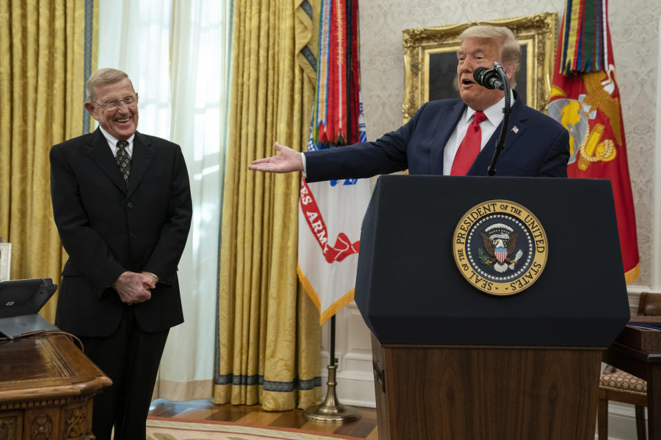 President Donald Trump speaks during a ceremony to present the Presidential Medal of Freedom to former football coach Lou Holtz, in the Oval Office of the White House, Thursday, Dec. 3, 2020, in Washington. (AP Photo/Evan Vucci)