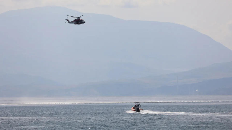 helicopter and boat off the coast of Porticello, near the Sicilian city of Palermo, Italy