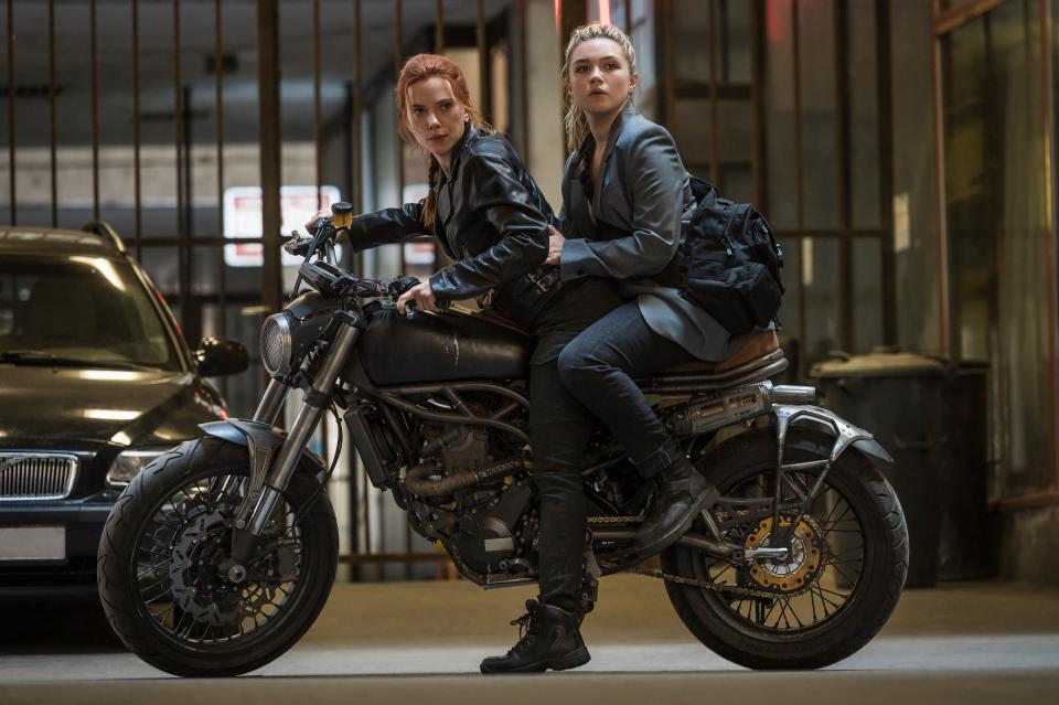 Natasha Romanoff (Scarlett Johansson, left) reconnects with her younger sister Yelena Belova (Florence Pugh) in &quot;Black Widow.&quot;