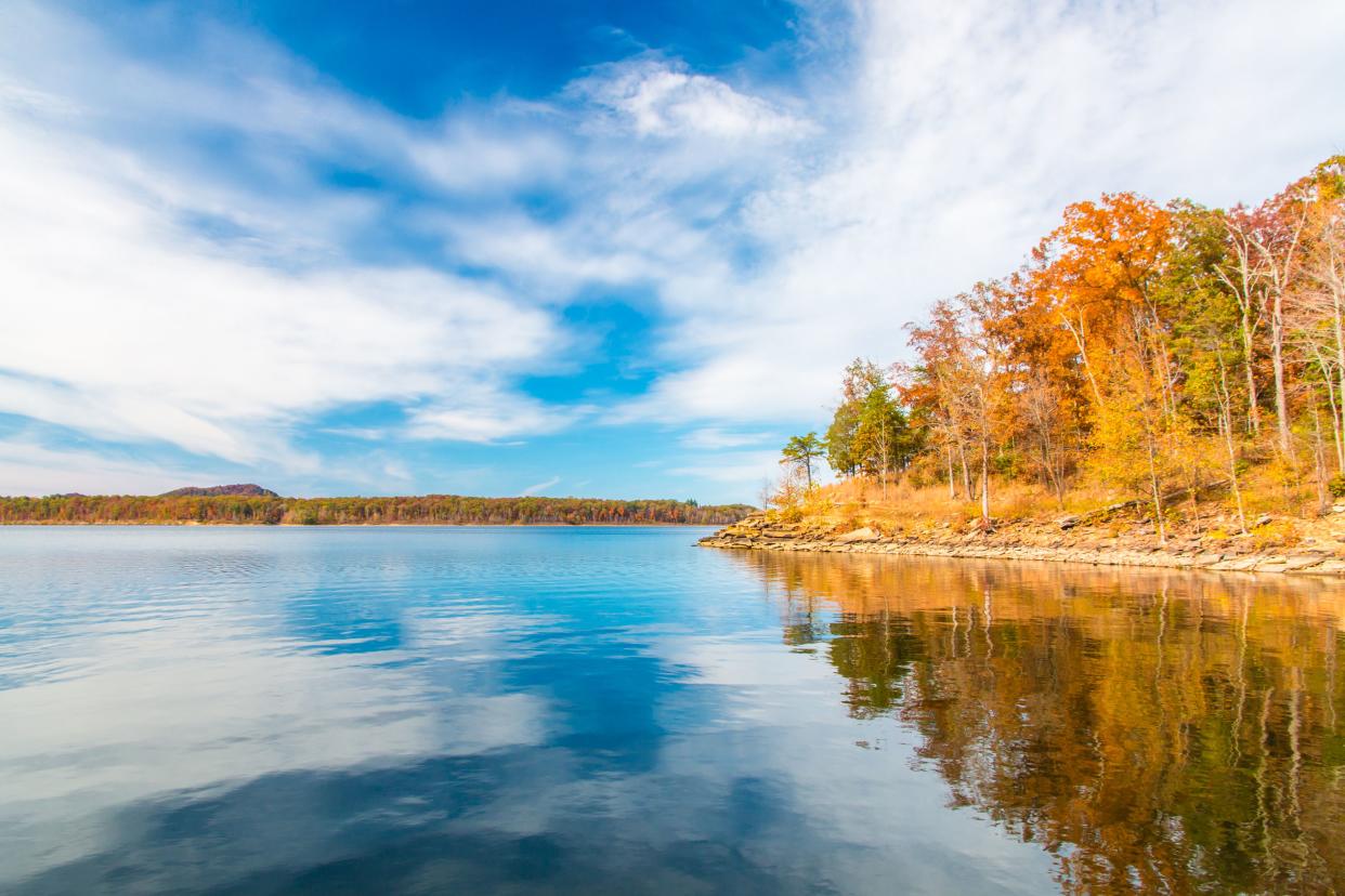 Autumn season at lake with beautiful forest at hill shore. Kentucky, USA