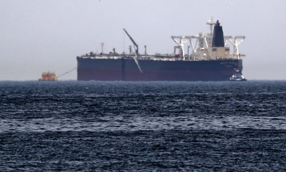 A picture taken on May 13, 2019, shows the crude oil tanker, Amjad, which was one of two Saudi reported tankers that were damaged  in mysterious "sabotage attacks", off the coast of the Gulf emirate of Fujairah. - Saudi Arabia said two of its oil tankers were damaged in mysterious "sabotage attacks" in the Gulf as tensions soared in a region already shaken by a standoff between the United States and Iran. (Photo by KARIM SAHIB / AFP)        (Photo credit should read KARIM SAHIB/AFP/Getty Images)