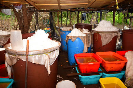 Plastic containers with chemicals to produce methamphetamine are seen at a clandestine drug processing laboratory where Mexican Marines seized 50 tons of methamphetamine discovered during an operation in the town of Alcoyonqui, on the outskirts of Culiacan, Mexico, in this handout photo released to Reuters by Mexico's Navy on August 17, 2018. SEMAR Mexico's Navy/Handout via REUTERS