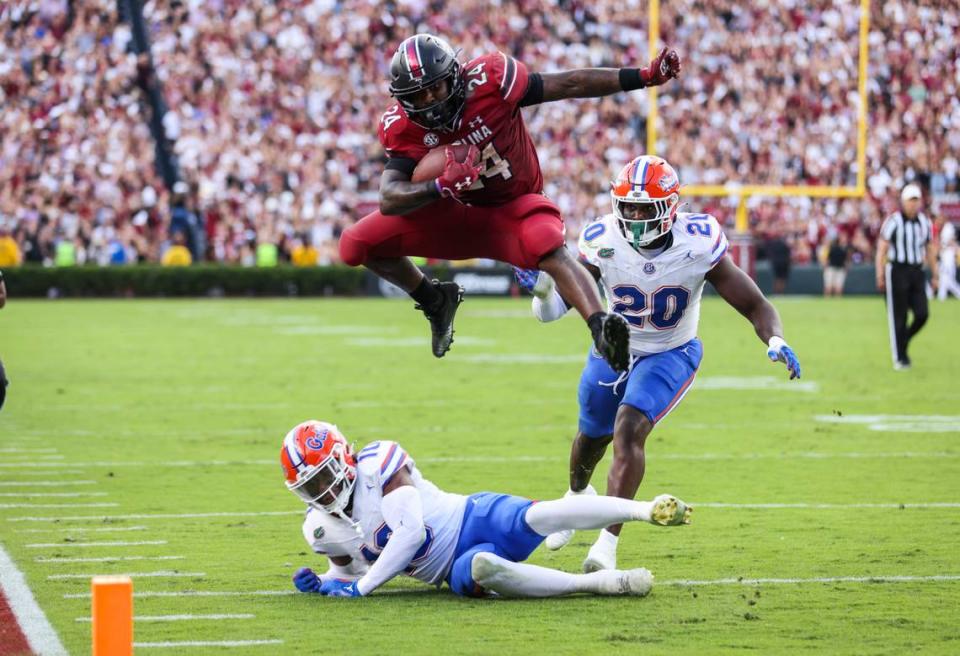 South Carolina running back Mario Anderson (24) hurdles Florida safety Miguel Mitchell (10) and scores during the second quarter of the teams’ Oct 14 game.