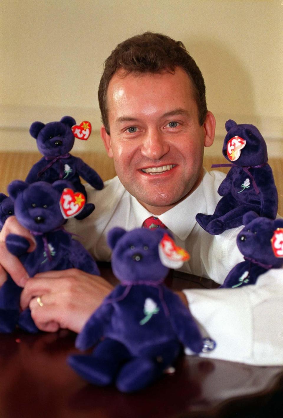 Diana’s butler and ‘rock’ Paul Burrell poses with the Diana Beanie Baby in 1998 (Alamy)