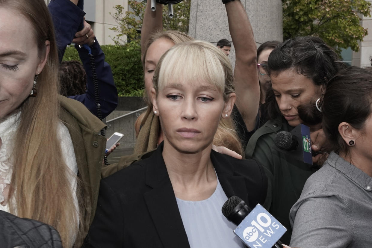 Sherri Papini leaves the federal courthouse after Federal Judge William Shubb sentenced her to 18 months in federal prison, in Sacramento, Calif., Monday, Sept. 19, 2022. Federal prosecutors had asked that she be sentenced to eight months in prison for faking her own kidnapping in 2016. (AP Photo/Rich Pedroncelli)