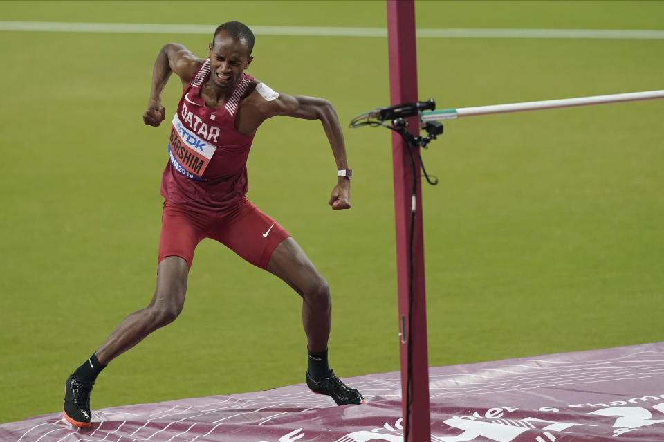 Mutaz Essa Barshim, of Qatar, celebrates after a jump during the men's high jump final at the World Athletics Championships in Doha, Qatar, Friday, Oct. 4, 2019. Barshim won the gold medal. (AP Photo/Denis Paquin)