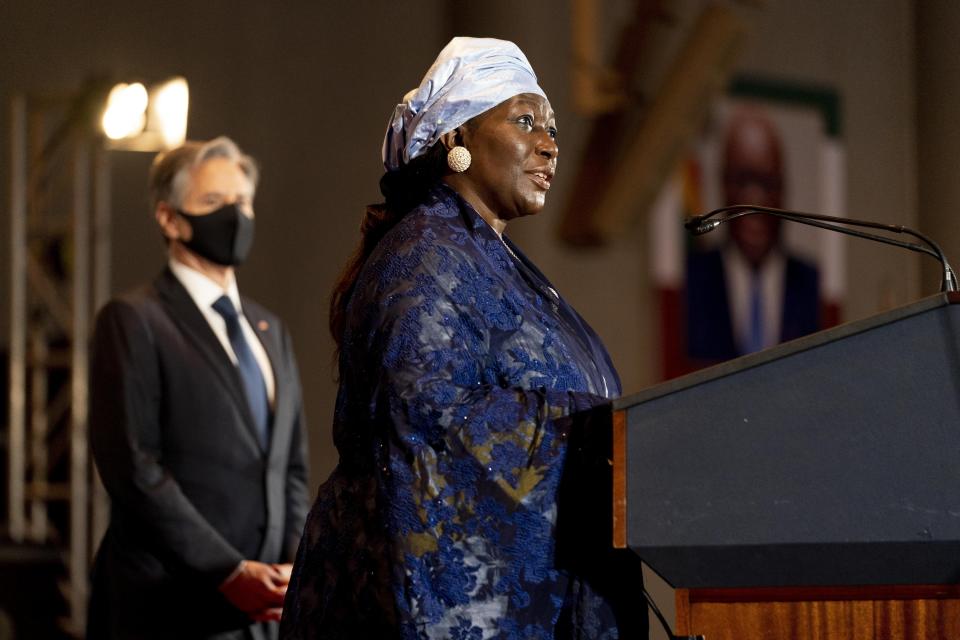 Nigerian Vice President Finda Koroma, accompanied by Secretary of State Antony Blinken, left, speaks before Blinken gives a speech on U.S. Africa Policy at the Economic Community of West African States in Abuja, Nigeria, Friday, Nov. 19, 2021. Blinken is on a five day trip to Kenya, Nigeria, and Senegal. (AP Photo/Andrew Harnik, Pool)