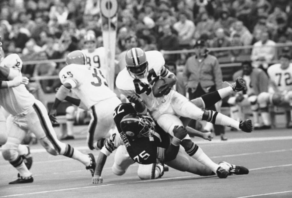 Pittsburgh Steelers defensive tackle Joe Greene (75) puts the stop on Cleveland Browns running back Leroy Kelly (44) in first quarter action on Sunday, Nov. 29, 1970 in Pittsburgh. The play at right guard gained one yard for the Browns as the Steelers held them for a net 42 yards rushing. Pittsburgh won it 28-9. (AP Photo/HC)