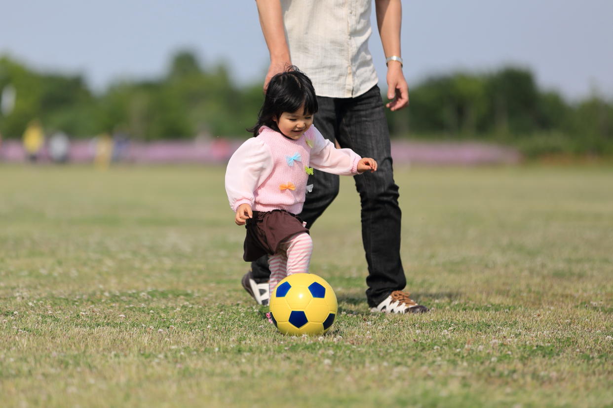 Playing sports with your kids can create lasting memories for both parent and child.