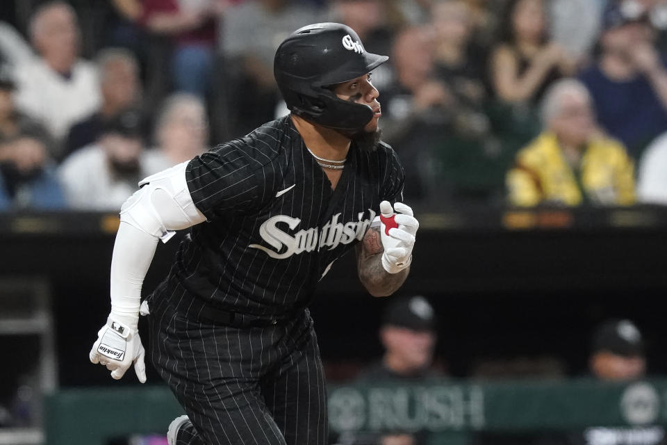 Chicago White Sox Yoan Moncada watches his single off Cleveland Guardians starting pitcher Zach Plesac during the fifth inning of a baseball game Monday, May 9, 2022, in Chicago. (AP Photo/Charles Rex Arbogast)