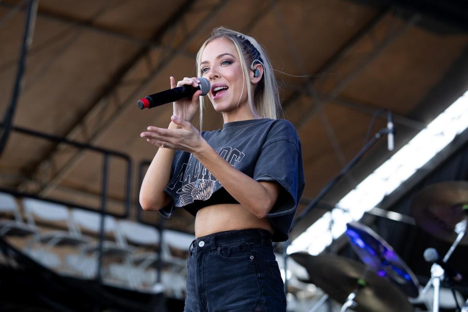 MacKenzie Porter sings to the crowd during Day 3 of Country Thunder Arizona 2022 in Florence, Ariz., on April 9, 2022.