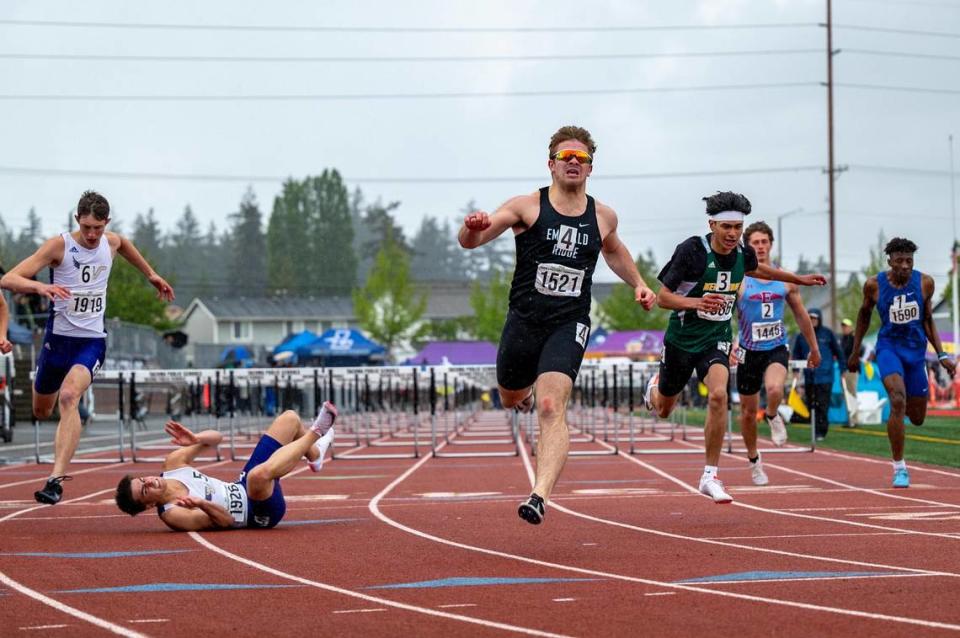 Asher Ogden from Emerald Ridge wins the state championship title for the Boys 4A 110 Meter Hurdles during the WIAA State Track & Field Championship at Mount Tahoma High School on Friday May 27, 2022.