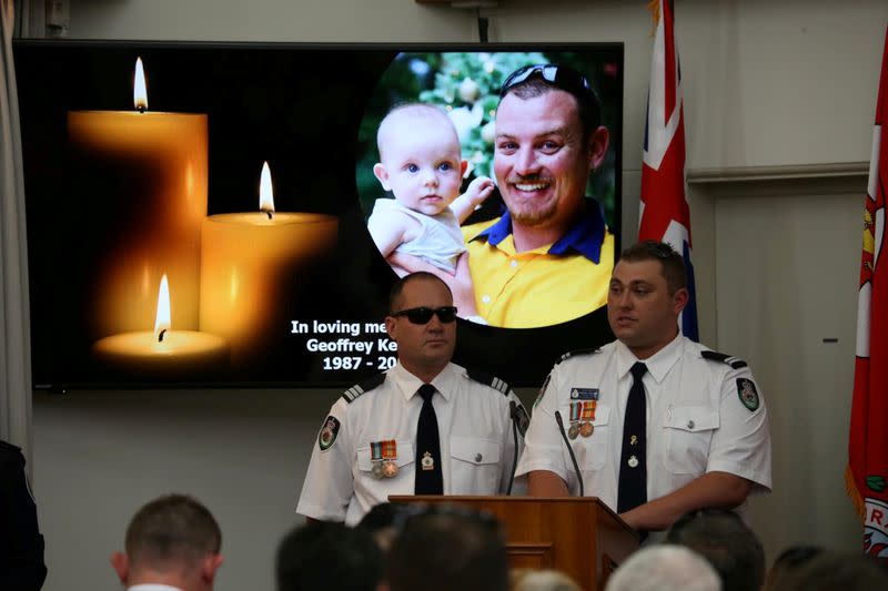 An image of late RFS volunteer Keaton is projected during his funeral in Buxton