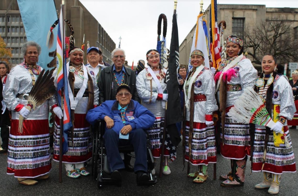 <em>Daniel Loudner (wheelchair), National Commander for the American Indian Veterans Association and Hunkpati Dakota, with the National Native American Women Warriors at the dedication for the National Native American Veterans Memorial in Washington, D.C on Friday, November 11. (Photo/Darren Thompson)</em>