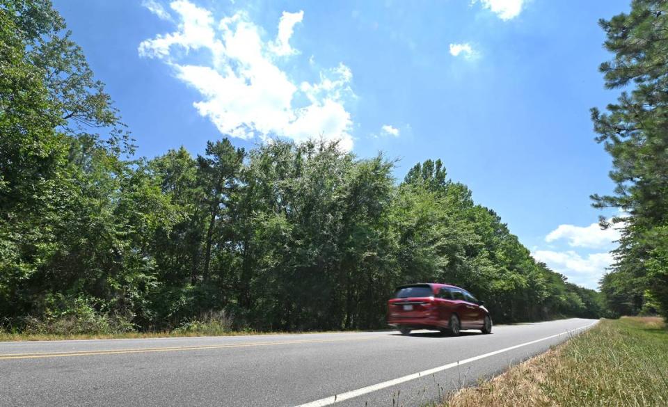 Traffic passes the planned entrance to Duke Energy’s proposed natural gas twin turbine energy plant on Island Point Road in Sherrills Ford, Catawba County, on Tuesday, June 25, 2024.