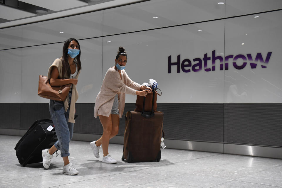 Passengers wearing face masks as they arrive at Heathrow Airport after a flight from Dubrovnik, Croatia, landed. The UK government announced that from 4am on Saturday, travellers to the UK from Croatia, Austria and Trinidad and Tobago will have to quarantine for 14 days on arrival.