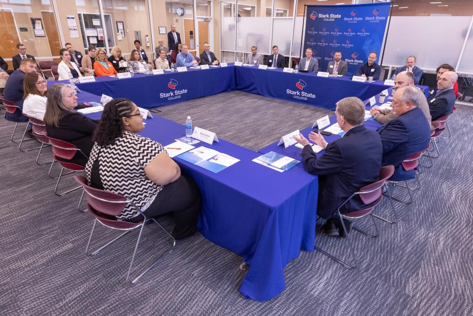 Local employers, government officials, educators and students attend an AI roundtable held at Stark State College on Friday.