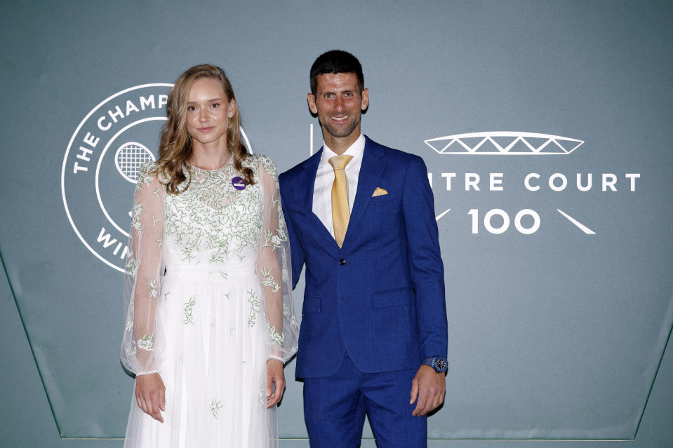 Singles champions Serbia's Novak Djokovic and Kazakhstan's Elena Rybakina pose for a photo at the Wimbledon Ball on day fourteen of the 2022 Wimbledon Championships at the All England Lawn Tennis and Croquet Club, Wimbledon, Sunday July 10, 2022. (Steven Paston/PA via AP)