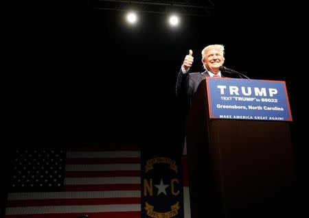 Republican presidential candidate Donald Trump reacts to his supporters at the start of his campaign rally in Greensboro, North Carolina on June 14, 2016. REUTERS/Jonathan Drake