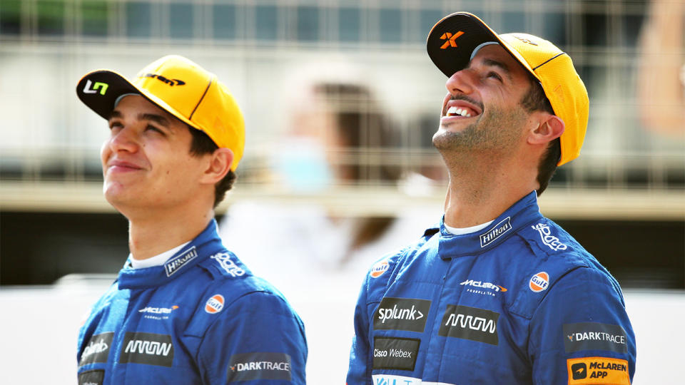 Daniel Ricciardo (pictured right) smiles next to teammate Lando Norris.