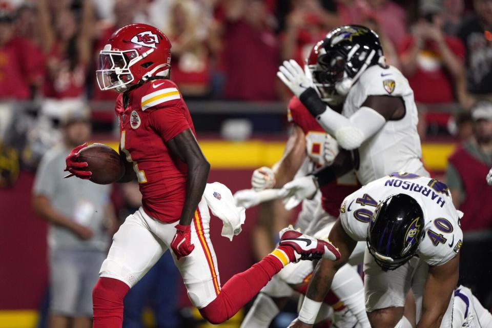 Chiefs wide receiver Xavier Worthy runs away from the Ravens defense for a touchdown in Week 1.