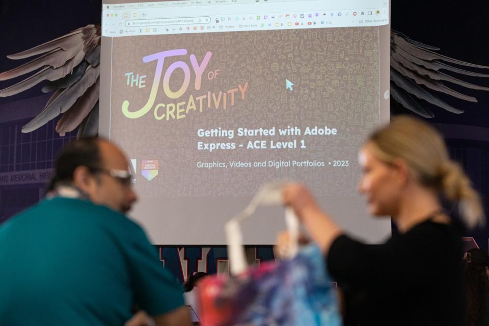 James Garcia and Tasha Jones, curriculum and instruction specialists for Fine Arts, wait for a demonstration on Adobe Express to begin at CCISD's Tech2Teach, a conference on technology in the classroom, on Wednesday, July 19, 2023, in Corpus Christi, Texas.