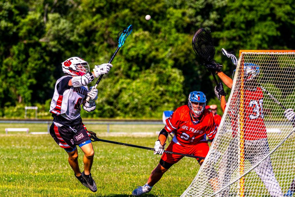 Old Rochester's Zack Zutaut makes a centering pass to a cutting teammate.