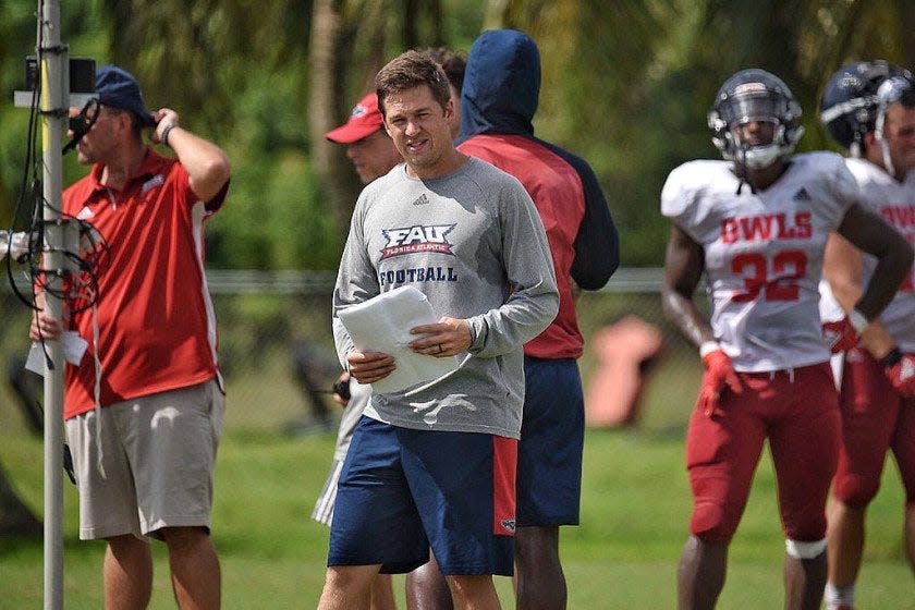 Charlie Weis Jr., watching an FAU practice in 2019, has been working under Lane Kiffin at Ole Miss.