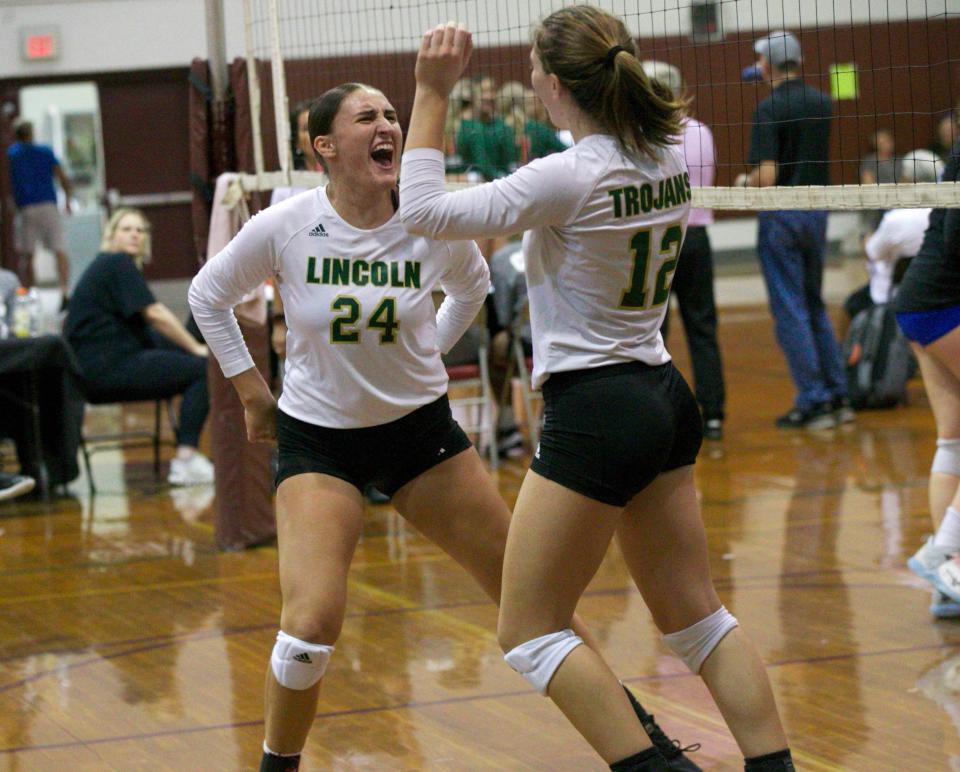 Lincoln junior Sydney Carroll (24) celebrates a point with junior Ashlyn Koerner (12)  during the North Florida Preseason Classic on Aug. 20, 2022, at Chiles High School.