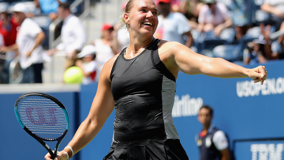 Kaia Kanepi celebrates her first round victory against Simona Halep. (Photo by Elsa/Getty Images)