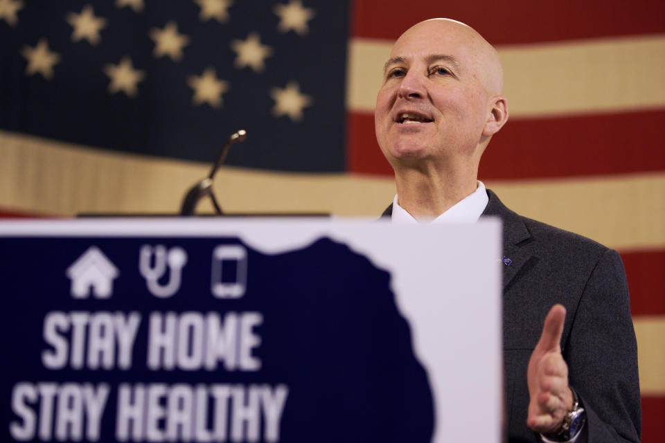 Neb. Gov. Pete Ricketts speaks during a news conference in Lincoln, Neb., Friday, April 10, 2020, on developments in the struggle against the COVID-19 coronavirus. (AP Photo/Nati Harnik)