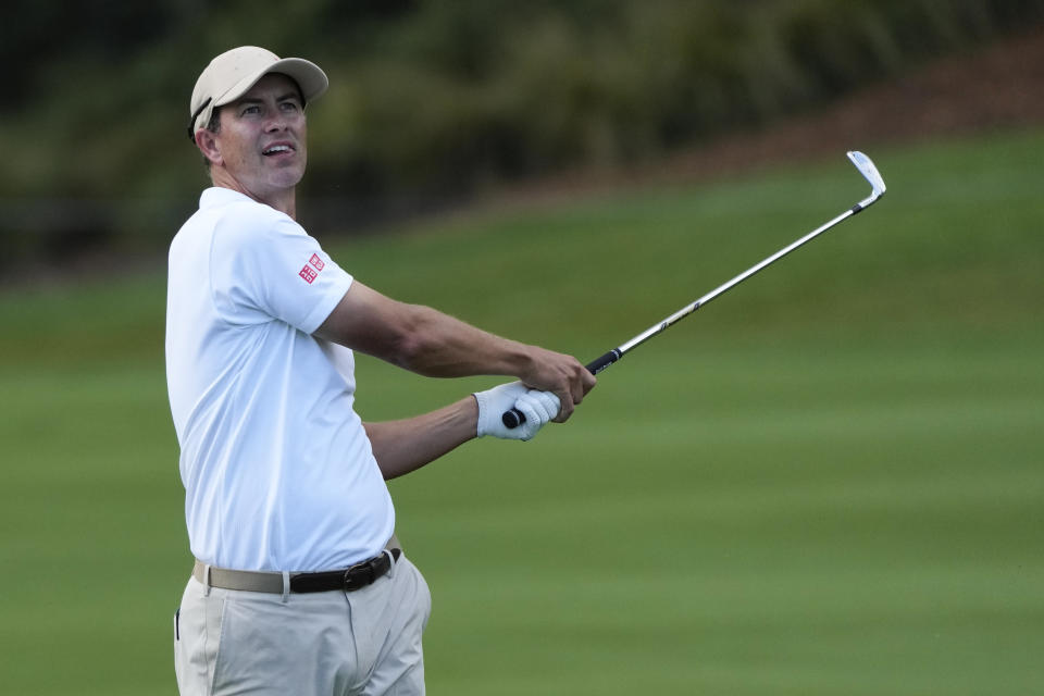 Australia's Adam Scott watches his approach shot into the seventh green during the first round of the Australian Open Golf Championship in Sydney, Australia, Thursday, Nov. 30, 2023. (AP Photo/Mark Baker)