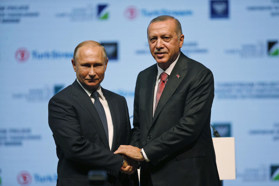 Russian President Vladimir Putin, left, and Turkey's President Recep Tayyip Erdogan, shake hands after attending an event marking the completion of one of the phases of the Turkish Stream natural gas pipeline, in Istanbul, Monday, Nov. 19, 2018. (AP Photo/Lefteris Pitarakis)