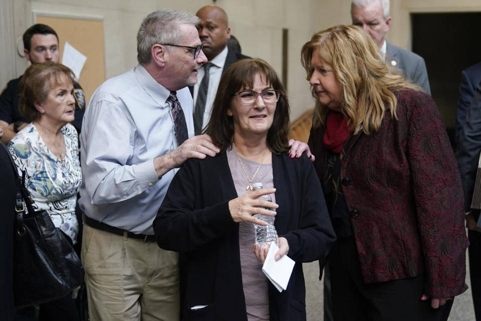 Darlene Altman, daughter of Diane Cusick, center, leaves a courtroom in Mineola, N.Y., Monday, Dec. 5, 2022. Richard Cottingham, the serial murderer known as the "Torso Killer", admitted Monday to killing Cusick, a 23-year-old woman, outside a Long Island shopping mall in 1968 and four other women decades ago. (AP Photo/Seth Wenig)