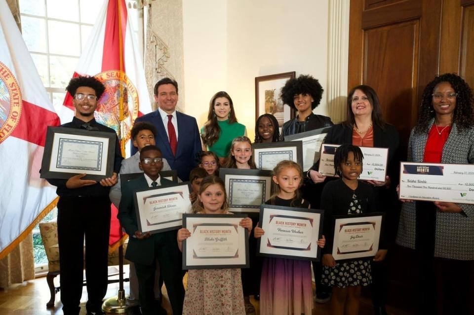 Joseph Gordon II and his brother Jeremiah Gordon, both homeschooled in Brevard County stand directly to the right of Gov. Ron DeSantis during a celebration in Tallahassee to recognize winning essays for Black History Month.
(Credit: Photo courtesy of the Executive Office of the Governor)
