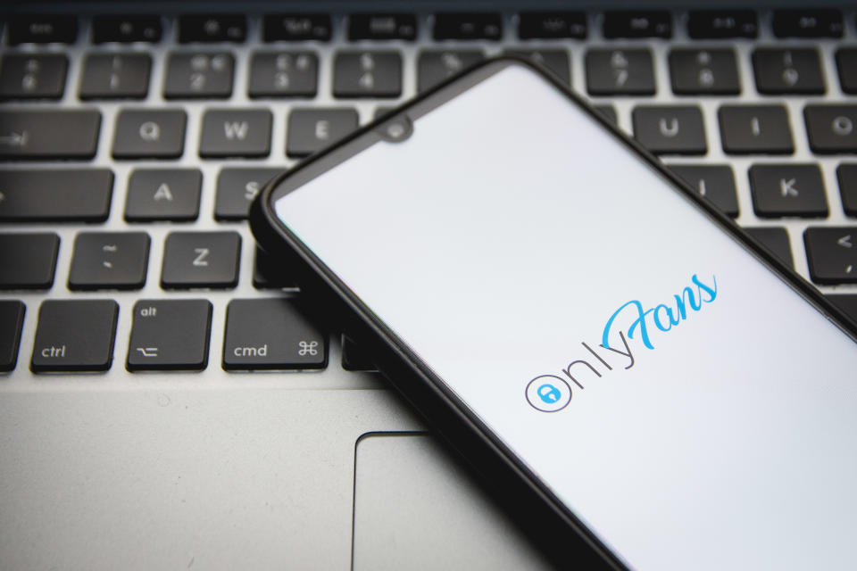 In this photo illustration an OnlyFans logo seen displayed on a smartphone screen with a computer keyword in the background in Athens, Greece on December 2, 2021. (Photo by Nikolas Kokovlis/NurPhoto via Getty Images)