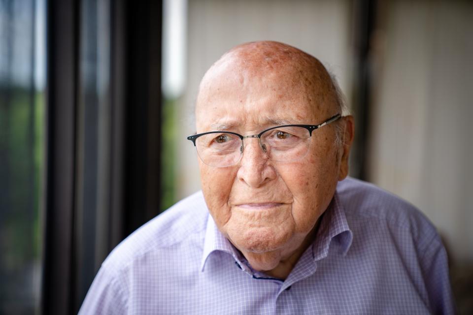 Holocaust survivor David Wolnerman stands for a photo at his home in Des Moines in 2022. He died Monday.