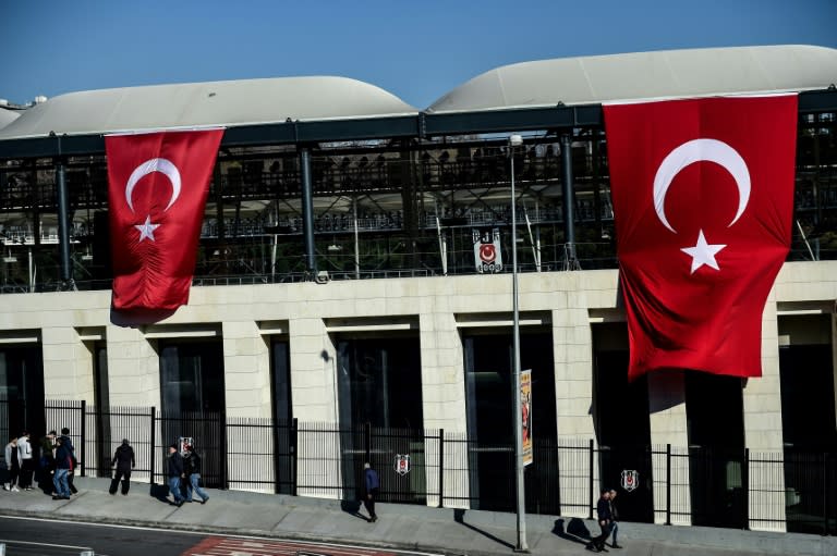 Turkish flags decorate the Vodafone Arena football stadium in Istanbul on December 11, 2016, a day after twin bombings