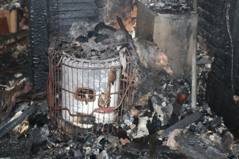 A picture of a damaged auxiliary heating device at a previous fire scene in the City of Corning.