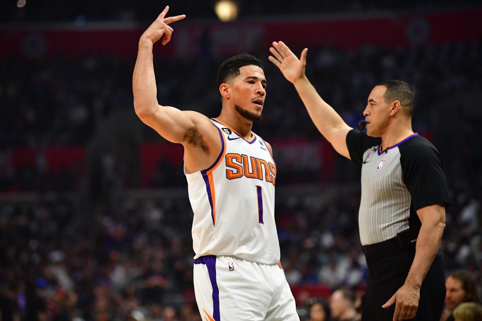 Phoenix Suns guard Devin Booker (1) reacts after scoring a three-point basket against the Los Angeles Clippers during the first half in game four of the 2023 NBA playoffs at Crypto.com Arena on April 22, 2023.