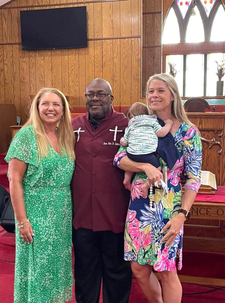 Lori Conrad, left, and Sarah James, right, pictured with Marion County School Board Chairman Eric Cummings at church nine days before the election.