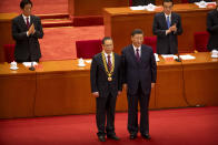 Chinese President Xi Jinping, right, stands with Chinese medical expert Zhong Nanshan after awarding him a medal at an event to honor some of those involved in China's fight against COVID-19 at the Great Hall of the People in Beijing, Tuesday, Sept. 8, 2020. Chinese leader Xi Jinping is praising China's role in battling the global coronavirus pandemic and expressing support for the U.N.'s World Health Organization, in a repudiation of U.S. criticism and a bid to rally domestic support for Communist Party leadership. (AP Photo/Mark Schiefelbein)