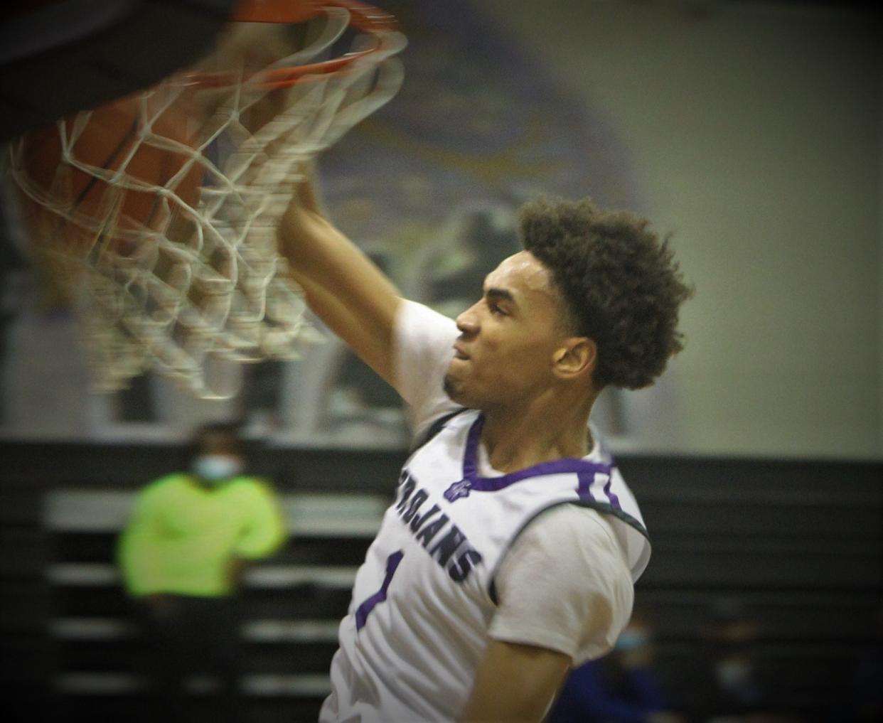 Milwaukee Bradley Tech's Learic Davis completes a dunk during the team's came with Watertown on Friday Dec. 10, 2021 at Bradley Tech High School.