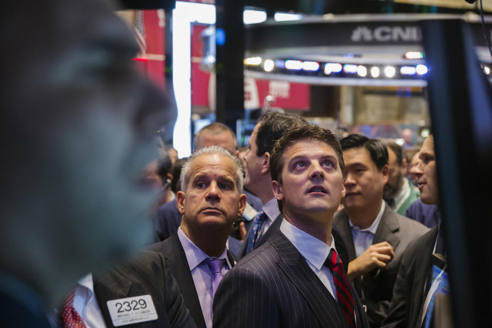 GrubHub CEO Matt Maloney looks up at a screen during the company's IPO, on the floor of the New York Stock Exchange in New York April 4, 2014. Shares of GrubHub Inc, the biggest U.S. online food-delivery service, rose as much as 57 percent in its market debut as investors scrambled for a piece of the fast-growing consumer internet company. REUTERS/Lucas Jackson (UNITED STATES - Tags: BUSINESS FOOD)