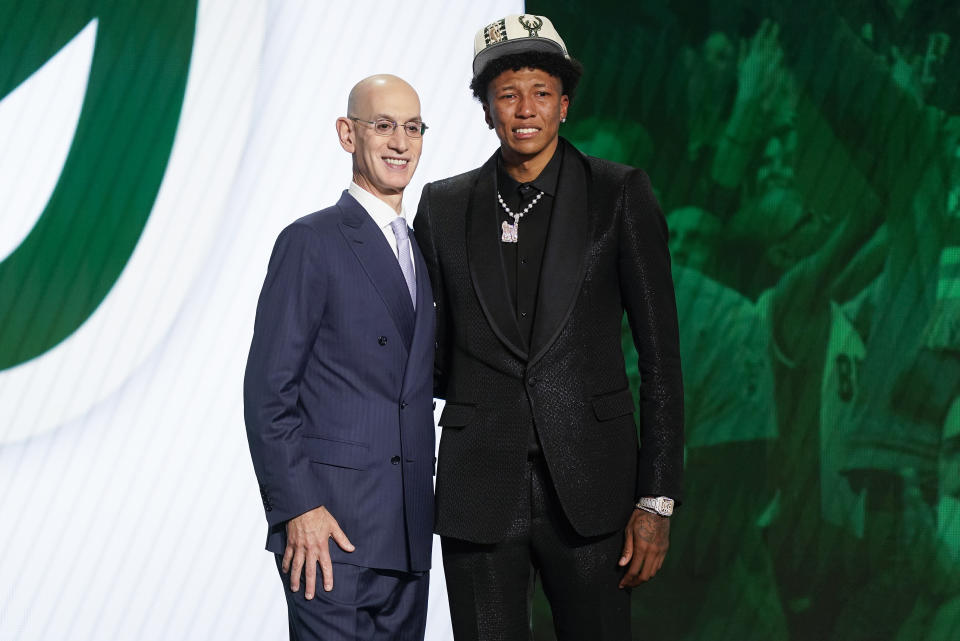 MarJon Beauchamp poses for a photo with NBA Commissioner Adam Silver after being selected 24th overall by the Milwaukee Bucks in the NBA basketball draft, Thursday, June 23, 2022, in New York. (AP Photo/John Minchillo)