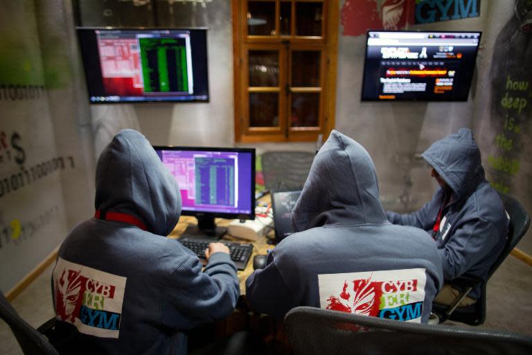 Trainees work at the "Cyber Gym" centre, where IT and infrastructure company employees train to defend against cyber attacks near the Israeli city of Hedera,on October 30, 2013