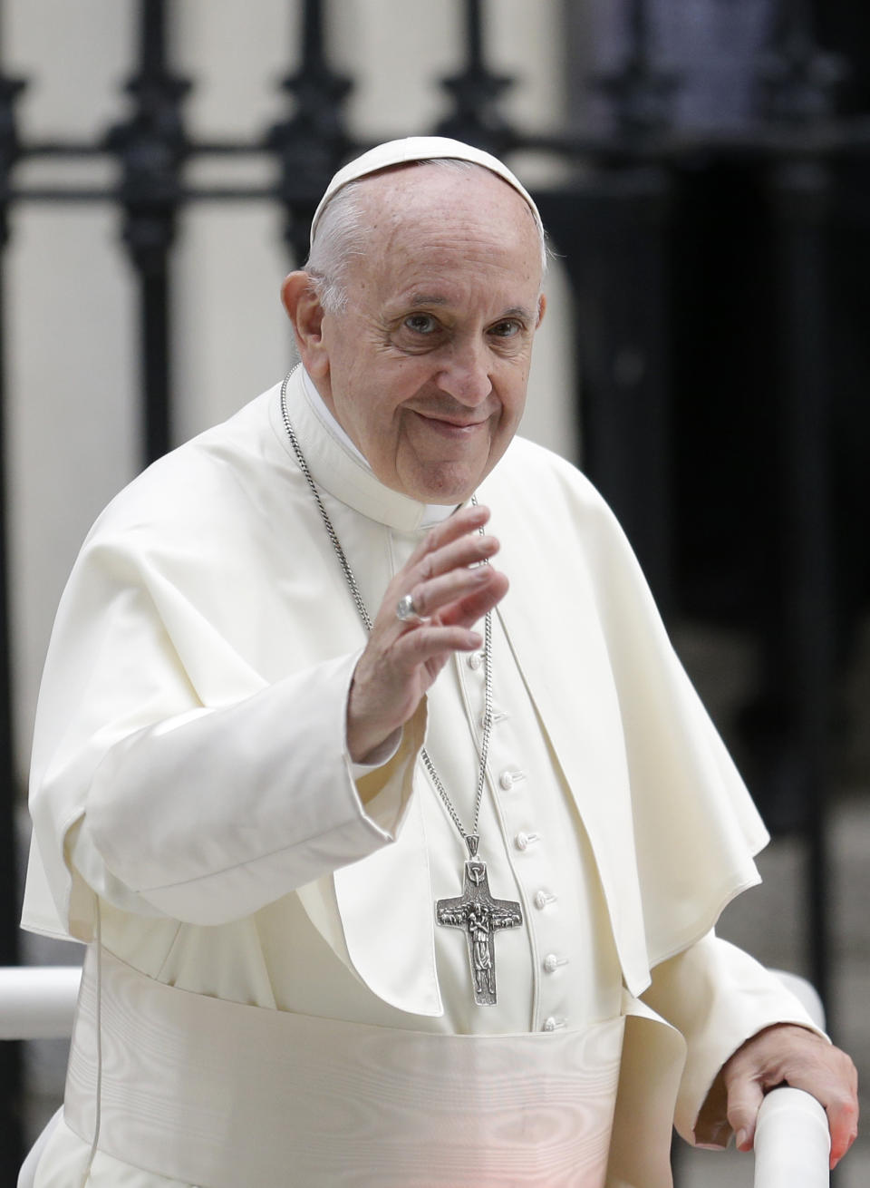 Pope Francis salutes the faithful as he leaves after visiting St Mary's Pro-Cathedral, in Dublin, Ireland, Saturday, Aug. 25, 2018. Pope Francis is on a two-day visit to Ireland. (AP Photo/Peter Morrison)