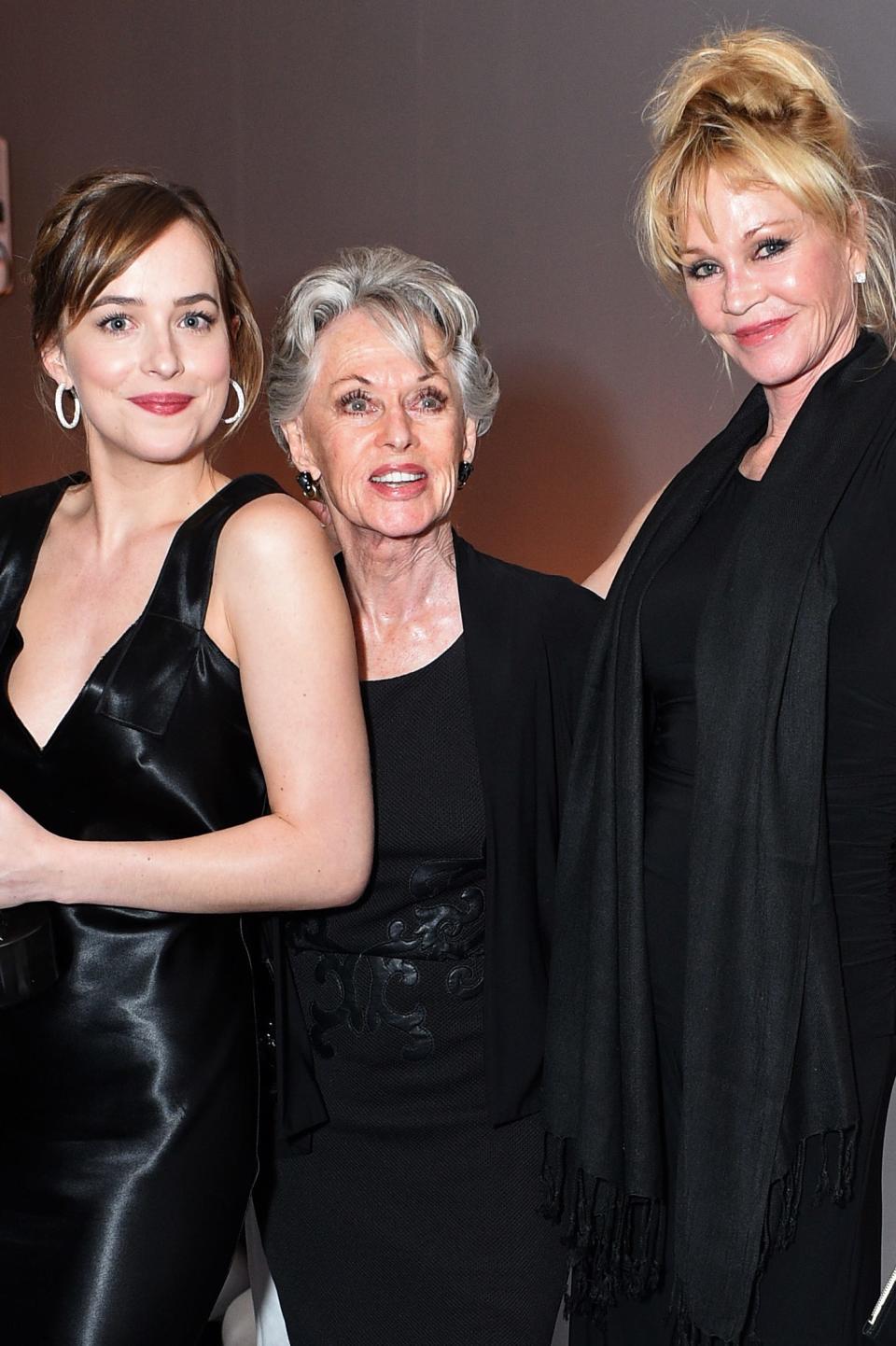 Actors Dakota Johnson, Tippi Hedren and Melanie Griffith pose with the Calvin Klein Emerging Star Award.