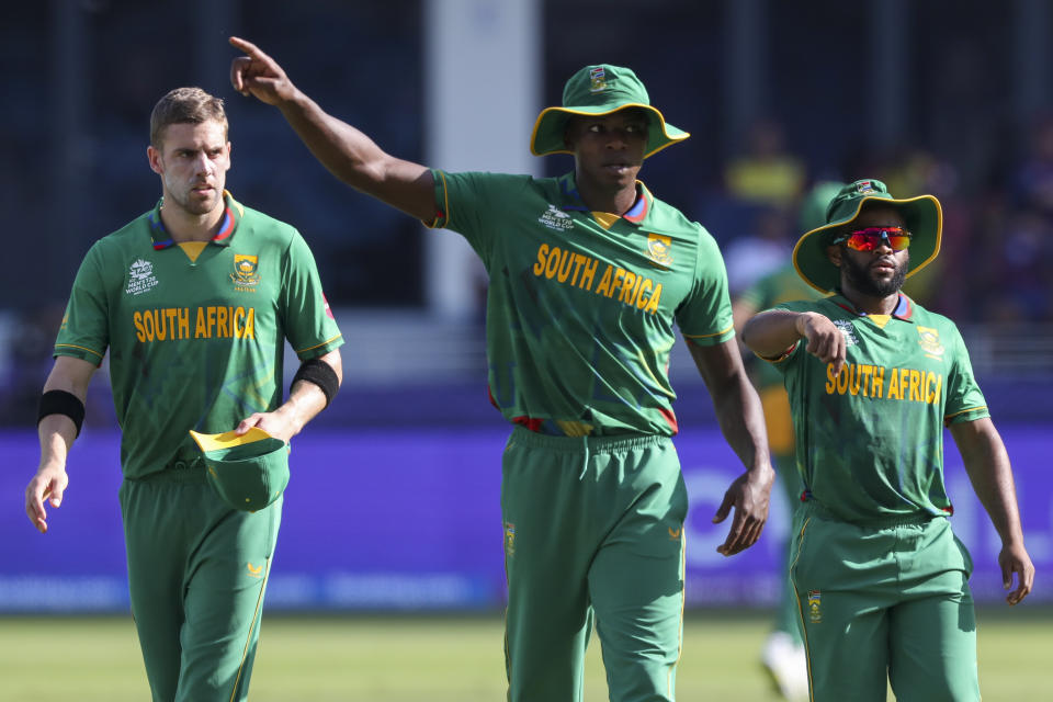 South Africa's Kagiso Rabada, centre, gestures to teammates during the Cricket Twenty20 World Cup match between South Africa and the West Indies in Dubai, UAE, Tuesday, Oct. 26, 2021. (AP Photo/Kamran Jebreili)